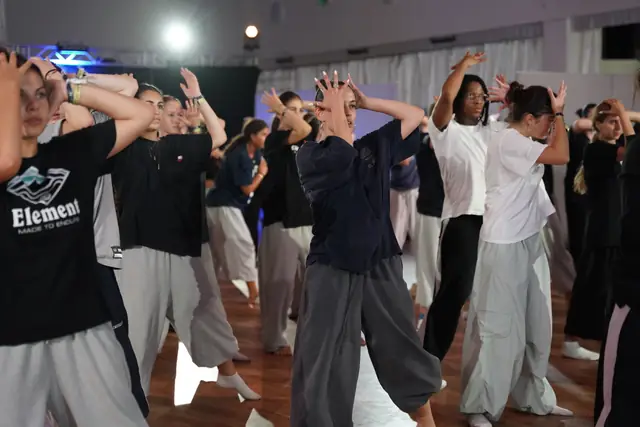 Students dancing in a crowded class, close-up